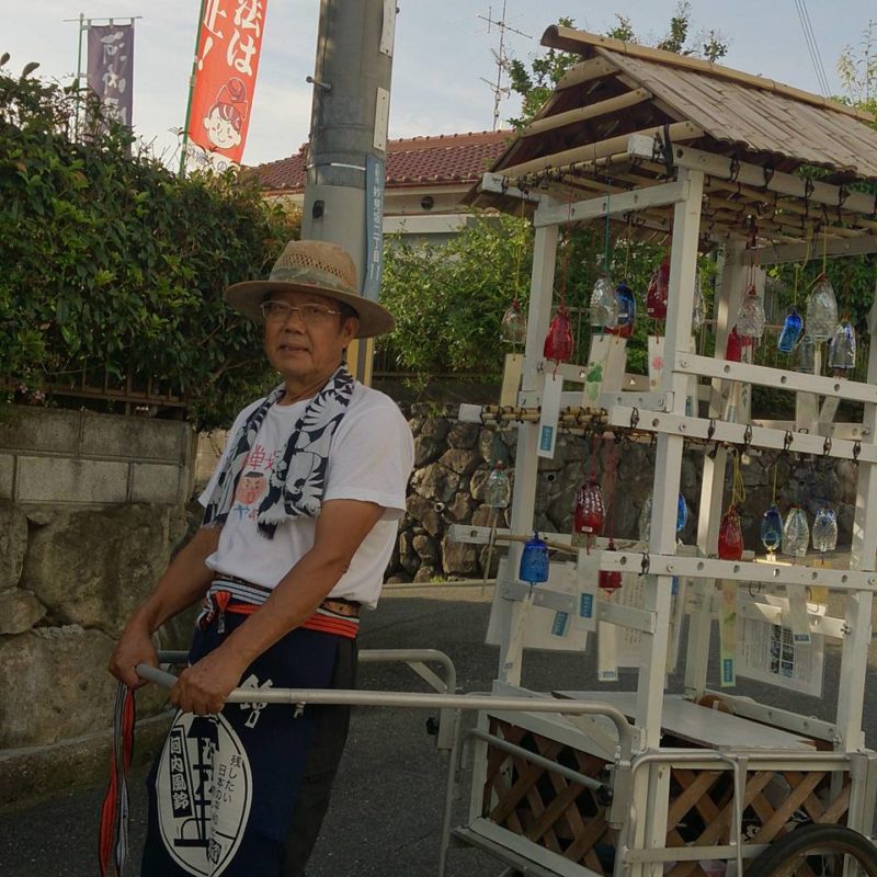 Mr. Kan Tugihiro selling windbells
